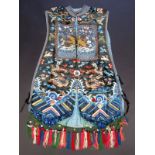 A 19th century Chinese silk and gold metal thread court robe, with two kesi rank badges,