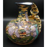A good Art Nouveau Bon Marche jug decorated with irises, indistinct maker's mark, height 25cm.