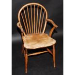 A 19th century yew wood stickback armchair, with elm seat.