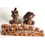 A pair of Klungkung, Bali, carved hardwood busts,