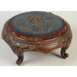 A Victorian walnut footstool, the beadwork seat decorated with a phoenix on carved cabriole legs,