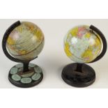 Two tin plate toy globes, height 20cm.