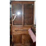 A George III mahogany secretaire bookcase with two glazed doors and plain corners,