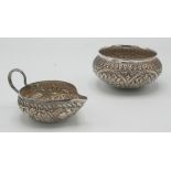 An Indian silver cream jug with cobra handle and an Indian silver bowl, 190g.