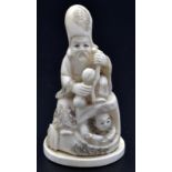 A Japanese ivory okimono depicting a figure of Fukurokoju seated upon a sack while holding two