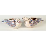 A pair of 19th century Persian pottery spill vases in the form of birds, length 20cm.