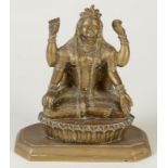 An Indian bronze figure of a goddess seated on a plinth. Height 16.5cm.