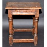 A 17th century oak joint stool.