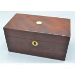 A George III mahogany two section, rectangular tea caddy with mother of pearl escutcheons, width 20.