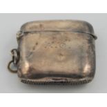 A plain curved silver vesta case, Birmingham 1906.