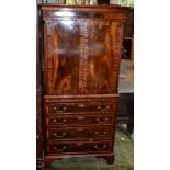 A Georgian style cabinet on chest of small proportions, mahogany veneered and crossbanded.