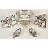 An oval pierced sweetmeat basket, small bon bon dishes a Copenhagen sauce boat and two other pieces.