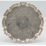 A George II silver waiter by Thomas Farren with engraved crests surrounded by engraved flowers and