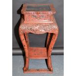 A Chinese red lacquered jardiniere stand,