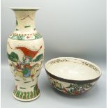 A Chinese Canton vase decorated in the famille verte style with a battle scene with equestrian