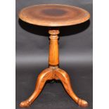 A tripod occasional table.