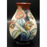 A Moorcroft Pottery 'Red Tulip' pattern vase with a baluster shape body,