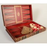 A set of red and natural bone draughts, in a good tooled gilt leather bound book case/board.