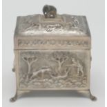 An Indian silver tea caddy of rectangular section portraying tigers and elephants, maximum width 10.