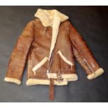 A leather and sheepskin flying style jacket with original retail label 'M B Sheepskins, Street,