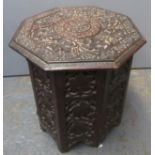 An Indian carved wood occasional table,