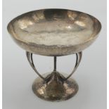 An Arts and Crafts hammered silver pedestal sweetmeat dish by Goldsmiths & Silversmiths Company,