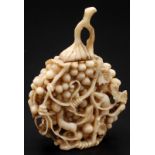 A Chinese ivory snuff bottle carved as a bunch of grapes with squirrels in and around the fruit,