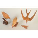 Three carvings of birds by J. Randall-Coles, a swallow , a song thrush and a water rail.
