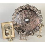 An ornate circular tray with a shell cast border, a pair of spill vases,