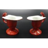 A pair of Chinese helmet shape libation cups decorated with dragons and flaming pearls,