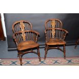 A set of four part yew wood 19th century Windsor, pierced vase splat armchairs,
