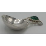 An Arts and Crafts pierced silver caddy spoon with a greenstone oval cabochon,