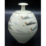 A slender neck vase by Derek Clarkson with speckled cream/white glaze and brushwork decoration,