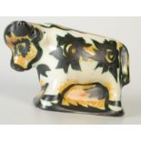 A Celtic Pottery Newlyn 'Folksy' pattern bull, sticker to base, length 23.5cm.