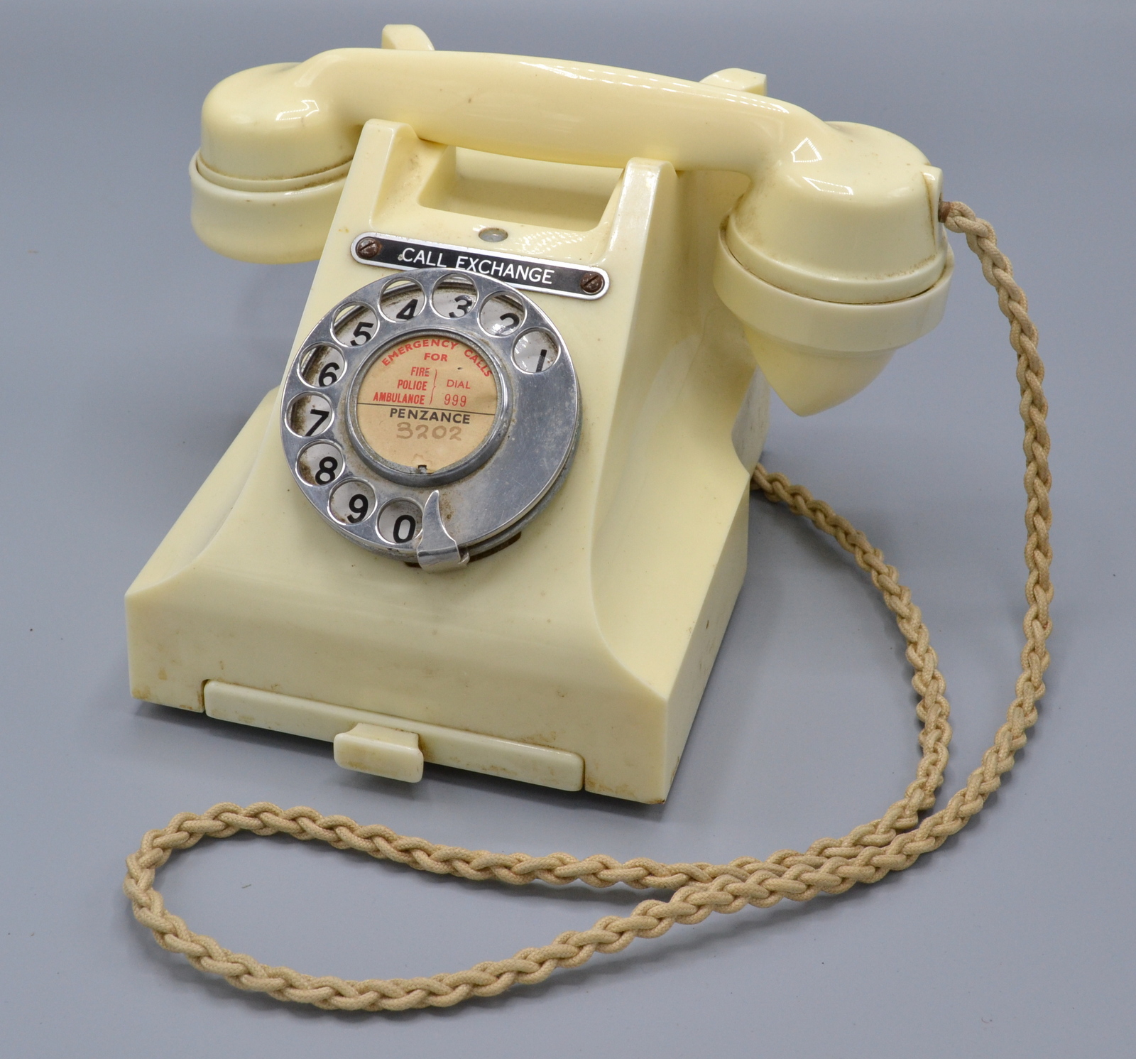 A GPO 300 series 1940s/50s ivory bakelite dial telephone with call exchange button,