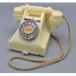 A GPO 300 series 1940s/50s ivory bakelite dial telephone with call exchange button,