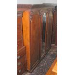 A Victorian mahogany veneered triple wardrobe.