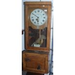 A Gledhill-Brook Time Recorders Ltd oak clocking-in clock, height 115cm,