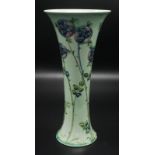 A William Moorcroft for Liberty 'Tudor Rose' pattern beaker vase, signed in green W.