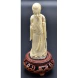 A Japanese ivory okimono figure of Jurojin "Long lived old man",