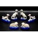 Two pairs of reproduction Staffordshire dogs and a pair of reproduction sheep.