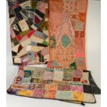 An Indian patchwork quilt with beaded and mirrored panels, 102 x 155cm, and other patchworks.