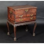 A colonial padouk small chest with hinged top, over two short and one long drawer,