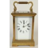 A French brass carriage clock with Roman numerals, height excluding handle 13.5cm.