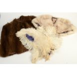 A 1930's fur cape and an ostrich feather fan, distressed.