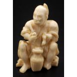 A Japanese ivory okimono,