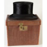 A silk top hat by Christys, London in leather box.