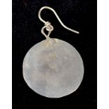 A single silver disc earring by Breon O'Casey. Hallmarked Birmingham 1981, B.O.C. maker's mark.