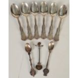 A set of six William Rogers teaspoons with flower cast handles and three Netherlands coin spoons.