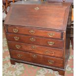 A George III mahogany slope front bureau.